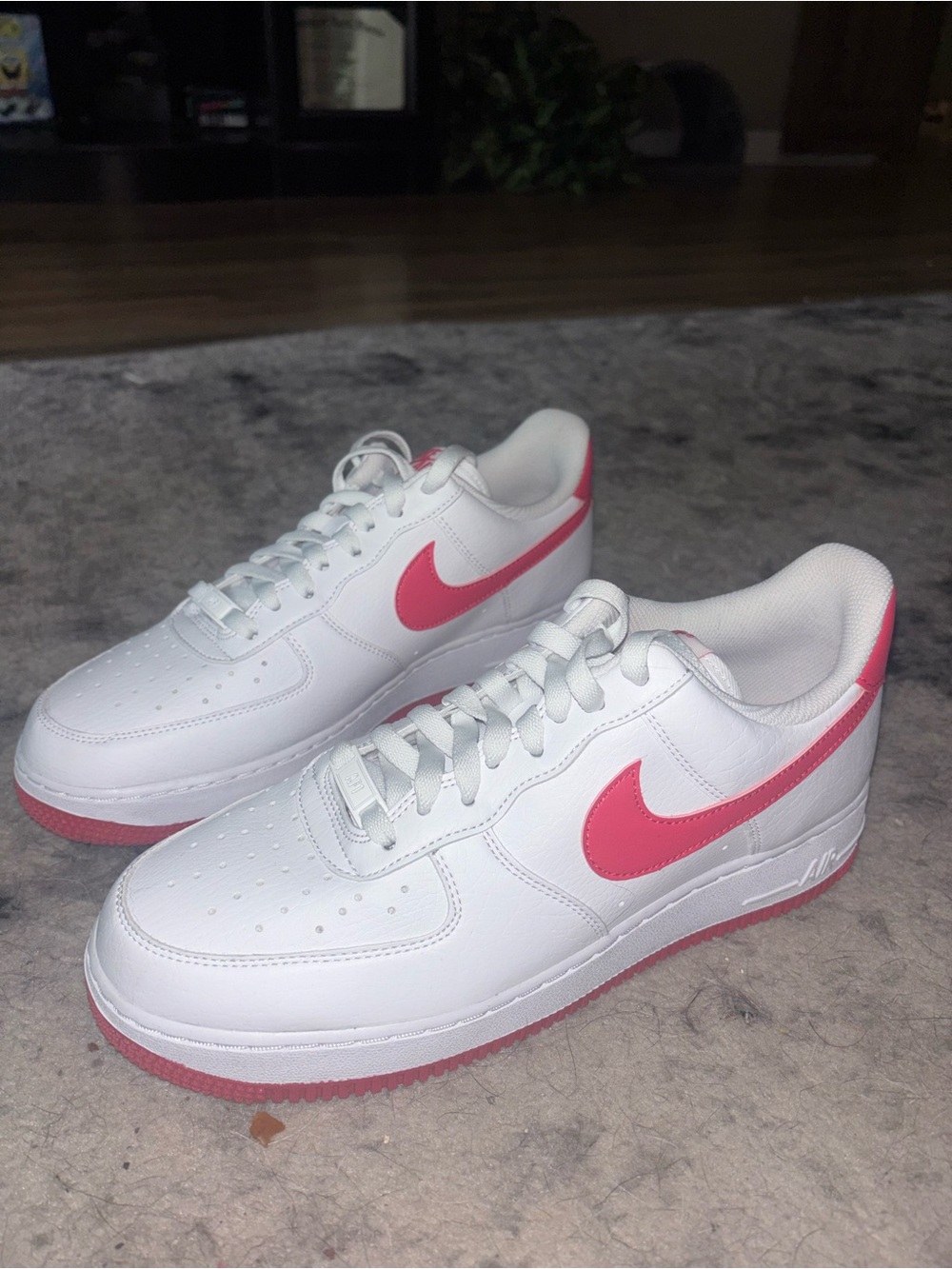 Nike Air Force White Sneakers with Pink Swoosh